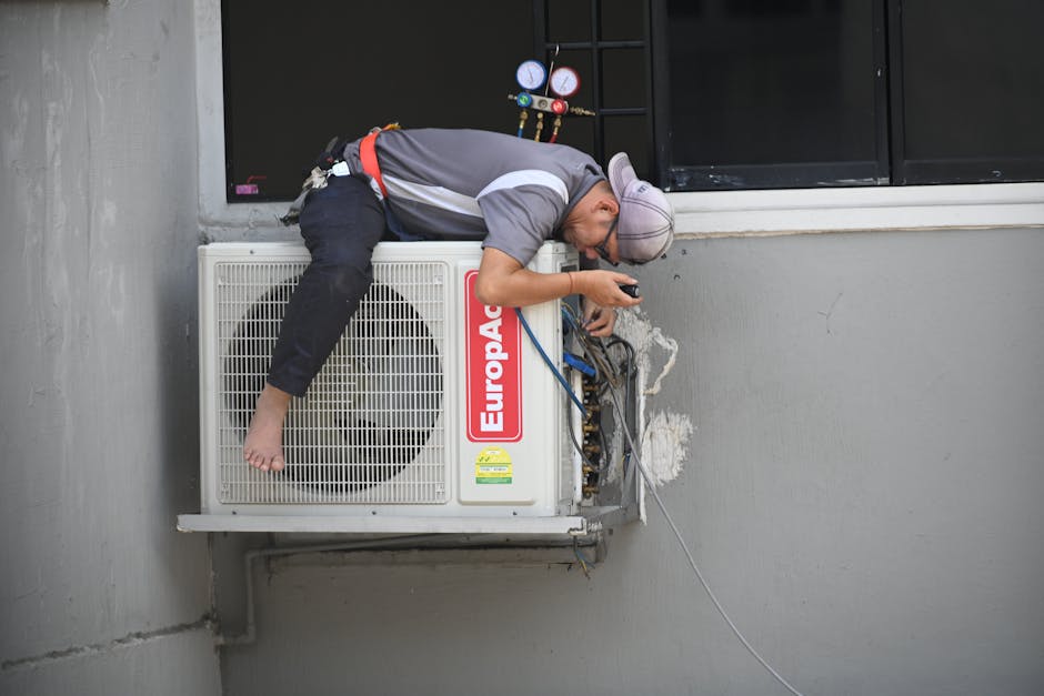 Air conditioning technician inspecting an outdoor HVAC unit